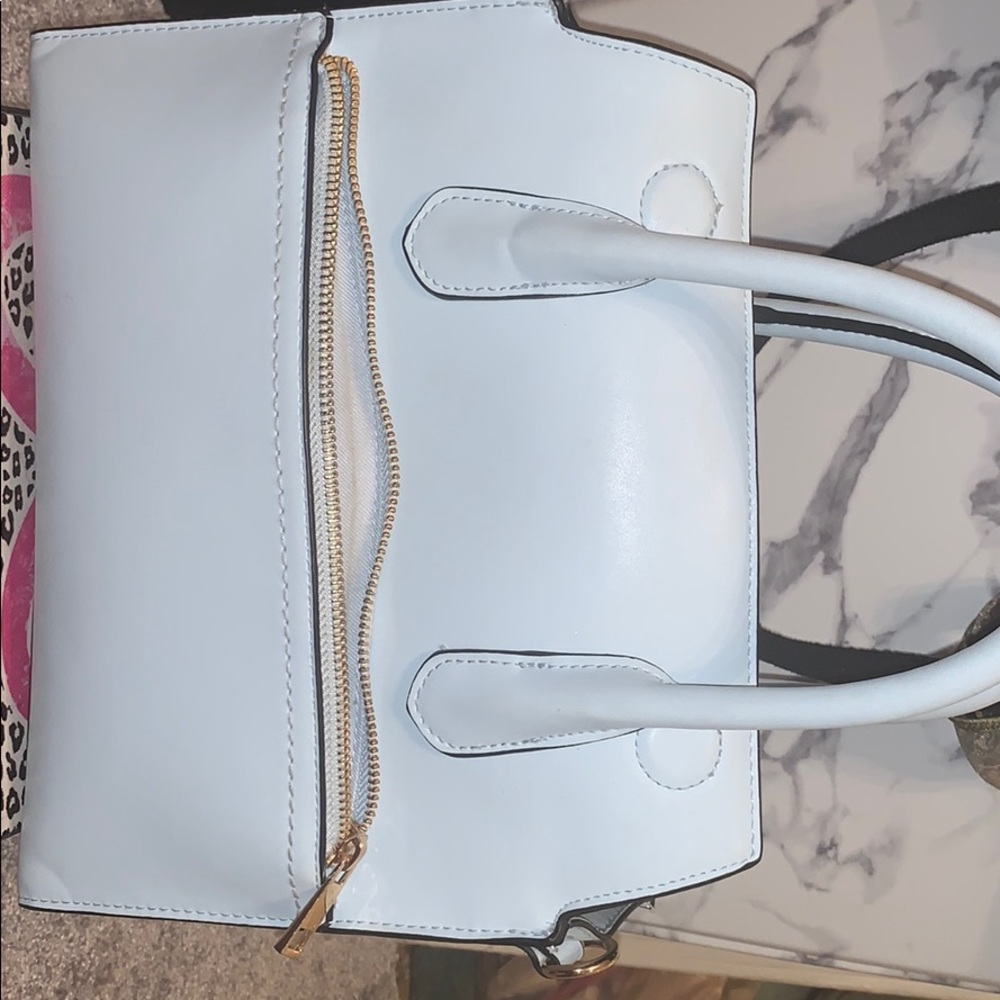 A nice light weight  sky blue Cross body purse